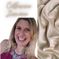 an image of a woman smiling and holding a piece of fabric