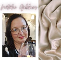 a woman is holding a glass of wine and a piece of fabric