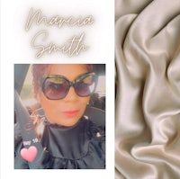 a photo of a woman wearing sunglasses and a heart shaped necklace