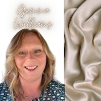 a woman is standing in front of a beige silk fabric