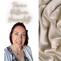 a woman is smiling and holding a piece of fabric