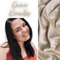 an image of a woman smiling with a piece of fabric