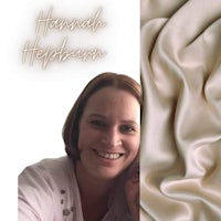 a photo of a woman smiling next to a piece of fabric