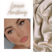 a photo of a woman with a blond hair and a beige background