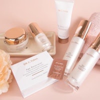 dr cinna skin care products on a pink background