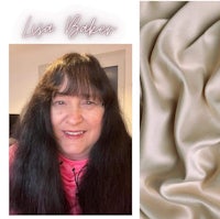 a photo of a woman with long hair and a beige silk fabric