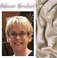 a picture of a woman with glasses and a piece of fabric