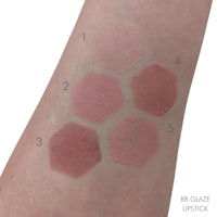 swatches of lipsticks on a woman's arm