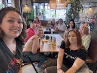 a group of people sitting at a table