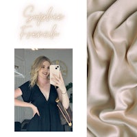 a woman is taking a selfie in a black dress